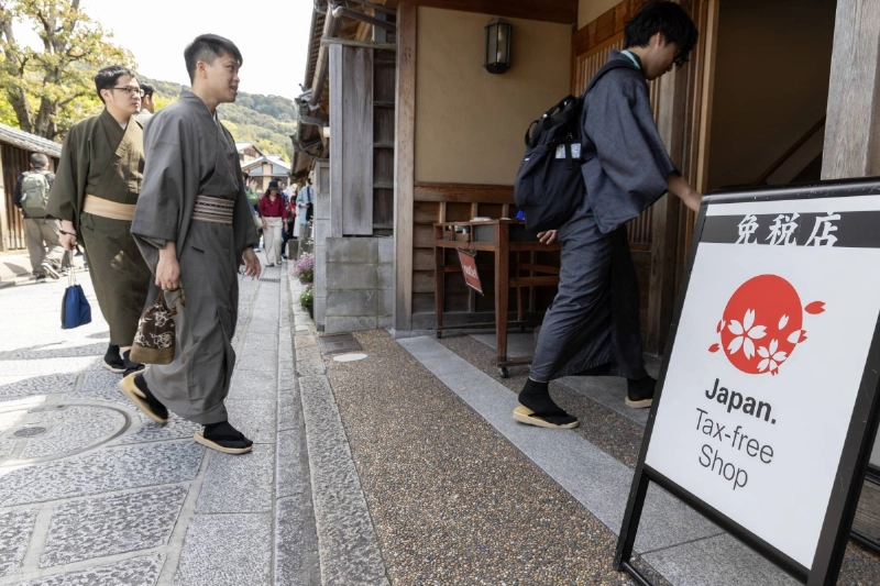 Japan eyes tougher rules for foreign residents and tax hike for tourists